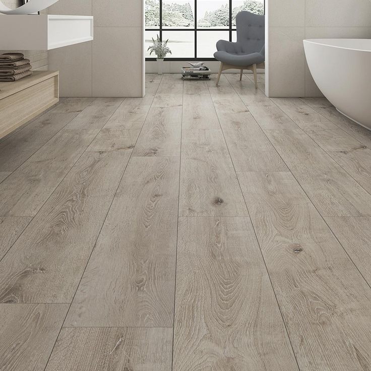 Custom bathroom luxury flooring and freestanding tub installation
